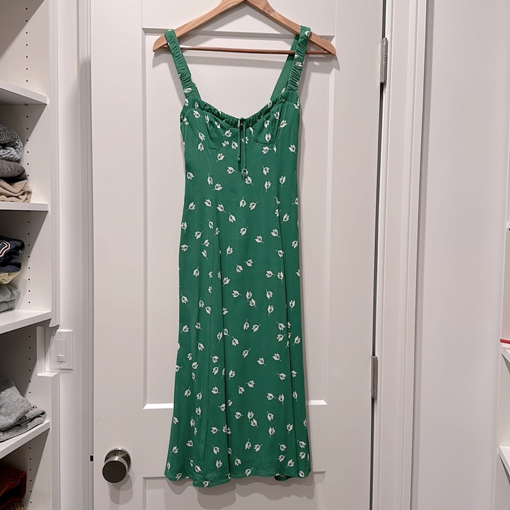 Green floral dress with high slit on left side. Sizing runs small.